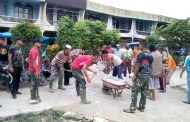 Satgas Tentara Manunggal Membangun Desa (TMMD) ke-106 maksanakan Over prestasi penimbunan sirtu di lapangan upacara