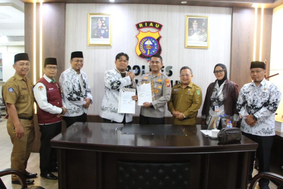 Sah, Ketua PGRI Inhil dan Kapolres Teken Kerjasama Mekanisme Penanganan Perkara dan Pengamanan Terhadap Profesi Guru